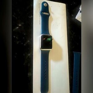 Apple Watch Series 3 (Rose Gold case) with original blue band.